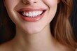 © SaroStock - a woman with a toothbrush in her mouth, a Perfect healthy teeth smile of young woman in black background