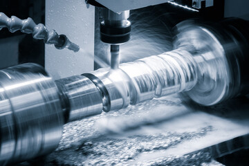 Aufkleber - A machine is grinding a piece of metal. The grinding process is creating a lot of dust and debris