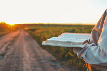 Canvas Print - Open bible in hands close-up, concept of calmness and morning solitude