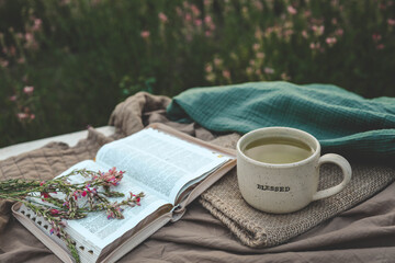 Sticker - Cup with text BLESSED and open Bible in the garden, good morning