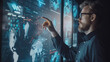 © sommersby - A man in a dark shirt is exploring a digital world map with data visualizations on a large screen, using his finger to analyze lines, points, and graphs