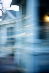 Canvas Print - a blurry picture of a house with a clock on it