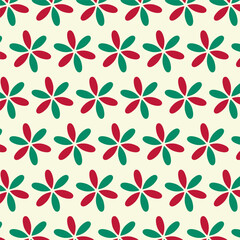 Wall Mural - Christmas seamless pattern.Green and red flower petal isolated on light yellow background.Vector graphic illustration.