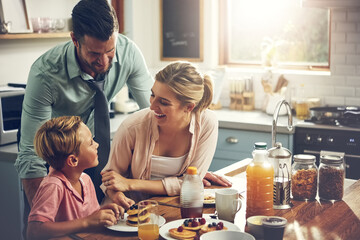 Poster - House, parents and boy with breakfast, funny and happiness in kitchen, bonding together and pancakes. Family, mother and father with kid, healthy food and meal with nutrition, wellness or cheerful