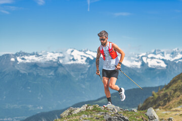 mountain athlete with poles