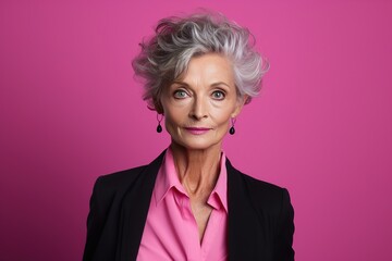 Wall Mural - A woman with gray hair and a pink shirt