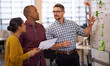© peopleimages.com - Business people, whiteboard and schedule with planning, teamwork and share ideas with newsroom. Research, employees and staff with project, talking and cooperation with copywriting or creative agency