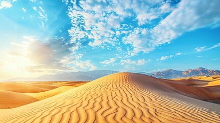 A vast desert landscape with golden sand dunes under a bright blue sky with fluffy white clouds.  The sun shines brightly, casting long shadows across the dunes.