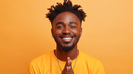 Canvas Print - A close-up portrait of a smiling man with an afro hairstyle against a yellow backdrop