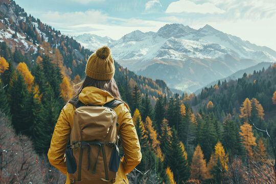 a woman looking at a mountain range