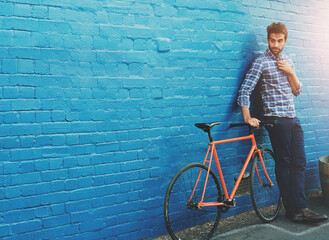 Canvas Print - Man, wall and thinking with bicycle in city for mockup space for travel, journey or direction on sidewalk. Person, bike and cycling for eco friendly commute on metro street for transport in Amsterdam