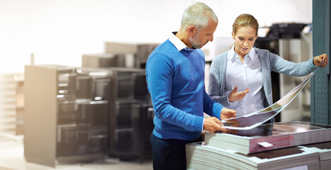 Poster - Man, woman and printing in warehouse with check, creative manager or designers with teamwork. Business people, together and factory with inspection for publishing material, collaboration on project