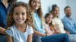 © NickArt - Close up photo of a cheerful smiling little elementary school child sitting with family in pediatric clinic near the wall --ar 16:9 Job ID: dff8eace-eb74-4996-af1b-7fd4e9c3155c