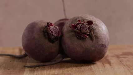 Poster - three beetroots on wooden surface food rotation