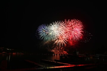 Beautiful colorful fireworks with reflections in water. Brno dam, the city of Brno-Europe. International Fireworks Competition.