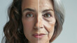 © VK Studio - A side-by-side image of a woman's face, split into young and old halves, symbolizes the evolution of beauty and time.