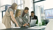 © peopleimages.com - Group, business meeting and laptop for statistics in corporate as consultant in accounting firm or bank in workshop or office. Screen, people and tech in collaboration for growth or career in finance