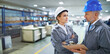 © peopleimages.com - Factory, people and checklist conversation with clipboard for quality inspection or logistics planning for process. Management, talking and document for manufacturing in warehouse with collaboration