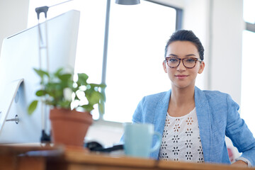 Poster - Desk, monitor and portrait of woman with smile for creative career, digital communication and research. Happy, employee and writer with computer in office for copywriting, website and online schedule