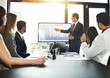 © ThurstanBuyout/peopleimages.com - Businessman, meeting and presentation with data on screen for hr metrics review, insights and planning. Leader, people and human resource analytics for employee performance and profit management