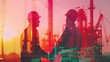 © Attasit - Two engineers wear helmet and vest standing hand shake with industrial double exposure background