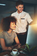 © peopleimages.com - Man, woman and computer at night office with information, research and teamwork for project management. People, collaboration and pc for support of planning, ideas and overtime proposal solution
