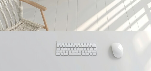 Close-up view of a white desk with a computer keyboard and mouse on it, captured from a top angle and high angle, featuring modern interior design with a wooden chair in the background.