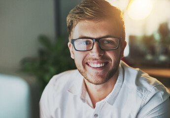 Wall Mural - Man, computer and night in workplace portrait, research and web designer for proposal. Male person, employee and networking or website for online tasks, project management and glasses on late shift