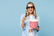 © ViDi Studio - Young cool woman she wears white top shirt casual clothes 3d glasses watch movie film hold bucket of popcorn in cinema point finger camera on you isolated on plain pastel light blue cyan background .