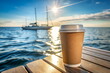 © irenastar - Craft paper coffee cup mockup blank standing at the stern of the yacht in sea landscape background. Copy space. Coffee take away branding mock up template