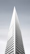 Modern skyscraper with a sleek design against a clear sky, showcasing contemporary architecture and urban sophistication.