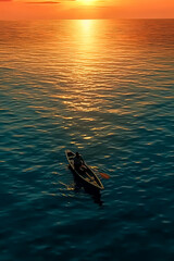 Wall Mural - A man is in a canoe on a lake at sunset