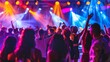 © ENJOINZ - A high-energy dance party with colorful lights, a packed dance floor, and a DJ spinning tracks as people dance the night away.