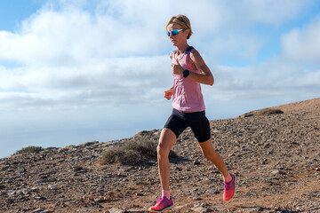 Dedicated female runner in natural setting