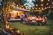 © Lux Images - Group of people gathered in a backyard on a summer evening