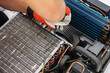 © Tomasz Zajda - Technician Working on RV Recreational Vehicle AC Unit With Screwdriver