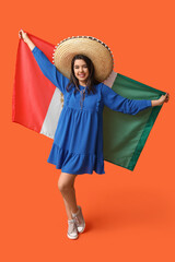 Sticker - Beautiful young happy woman in sombrero with Mexican flag on orange background. Cinco de Mayo celebration