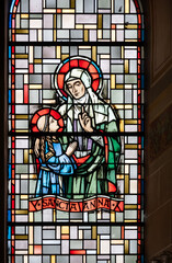 Wall Mural - Saint Anne (the Mother of the Virgin Mary). A stained-glass window in Église de la Sainte-Trinité (Holy Trinity Church) in Walferdange.	
