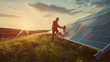 © Kafka - Solar panel technician performing checks and maintenance in a solar farm