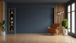 © Vanit่jan - Living room with leather armchair on wood flooring and dark blue wall- 3D rendering