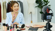 © aFotostock - Beauty blogger video production for female fashion blog online cosmetic adviser record woman lifestyle tutorial. Trendy female vlogger showing how to use cosmetics products live via social media.