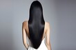 © Marco Mamdouh - Beautiful long black straight hair on white background, Model for hair cosmetics products, Back view