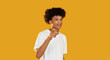 © golubovy - You pointing. Encouraging gesture. Confident smiling guy supporting showing approval isolated on yellow empty space background.