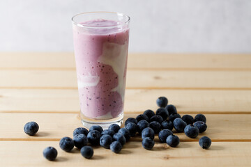 Wall Mural - Blueberry smoothie with yogurt in a glass.