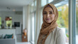 © Kafka - Positive hijabi realtor strikes professional pose in sleek home environment