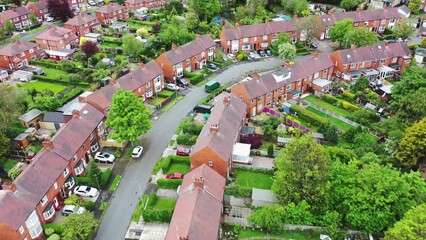 Wall Mural - Aerial footage of the City of Wakefield in West Yorkshire UK, showing a typical British housing estates with roads and streets, taken with a drone on a sunny day in the summer time above the houses.