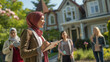 © Kafka - Hijabi Real Estate Agent Walking Client to a House Tour