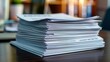 © IYearDesign - Stack of resumes on a desk, job loss, recession unemployment search