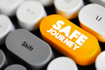 Safe Journey is a well-wishing expression used to convey hope for someone's safe travel and arrival at their destination, text concept button on keyboard