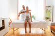 © Westend61 - Physical therapist treating teenage patient for chiropractic adjustment of shoulder in rehabilitation center